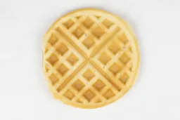 The light brown bottom crust of a waffle baked for 7 minutes using our Birch Benders batter.
