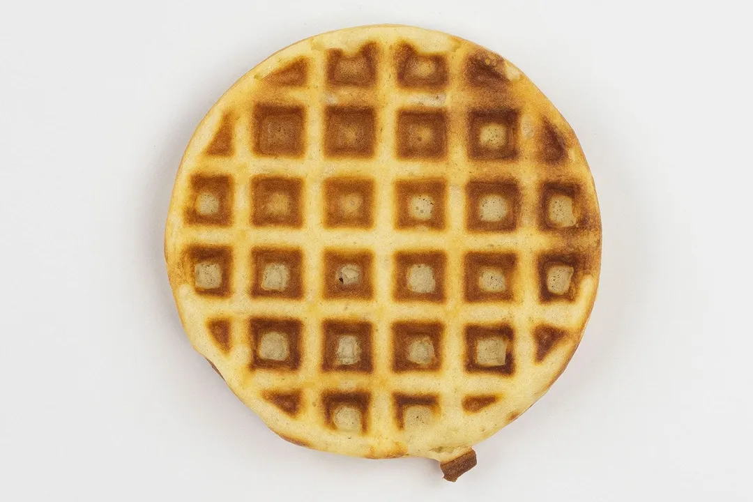 The golden-very dark brown top crust of a waffle baked for 6 minutes using our self-mixed recipe.