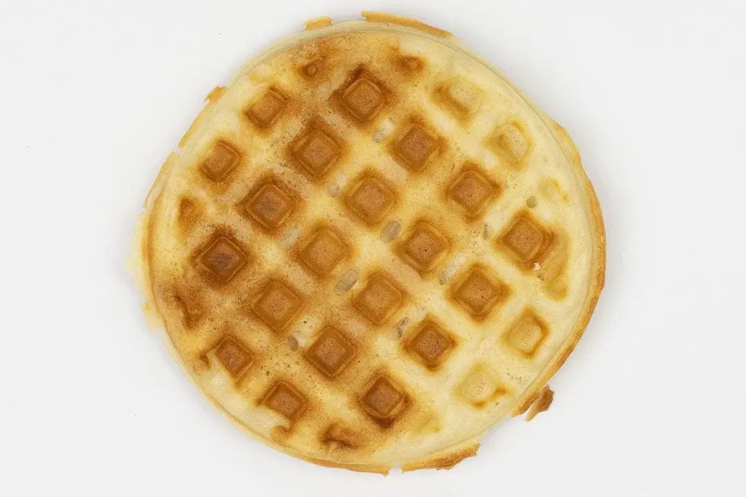 The very dark brown top crust of a waffle baked for 7 minutes using a batter made from our Birch Benders mix.