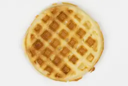 The very dark brown top crust of a waffle baked for 7 minutes using a batter made from our Birch Benders mix.