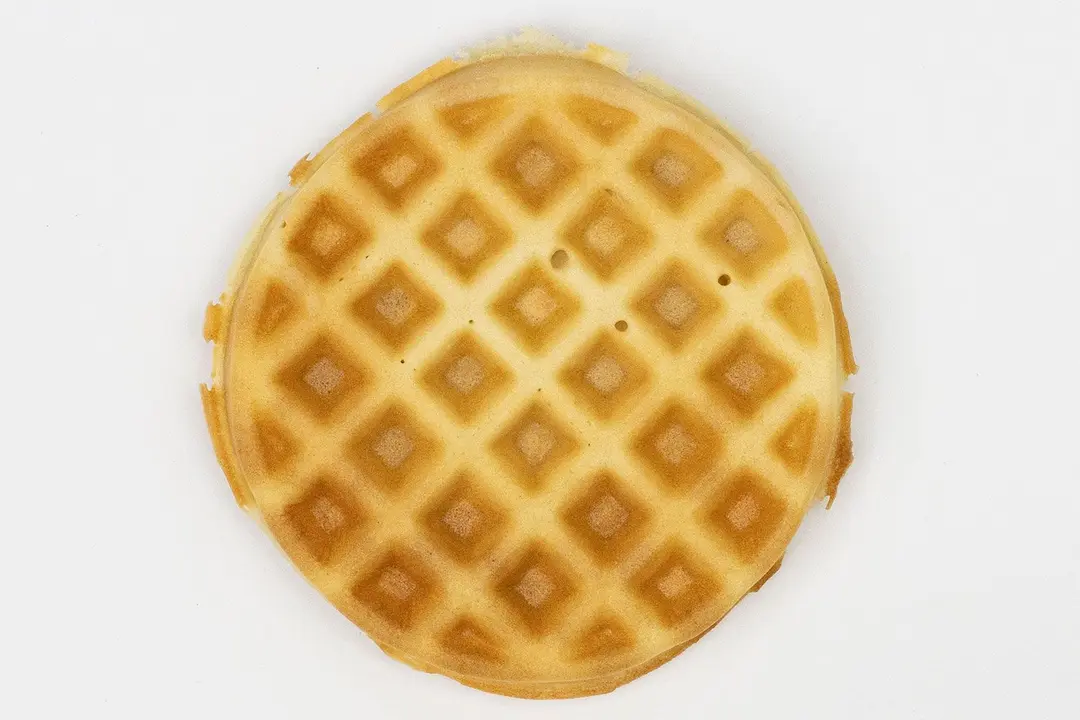The very dark brown bottom crust of a waffle baked for 7 minutes using a batter made from our Birch Benders mix.