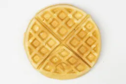The golden bottom crust of a waffle baked for 8 minutes using a batter made from the Birch Benders mix.