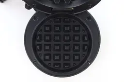 A top-down view of one of the waffle plates of the Crownful waffle maker.