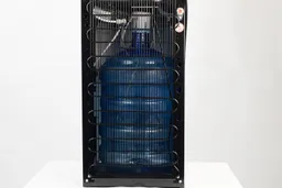 Rear view of a bottom loading water cooler dispenser with a full bottle of water seen inside.