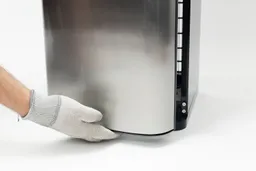 The door cabinet of a water cooler dispenser being opened from the bottom and not the side.