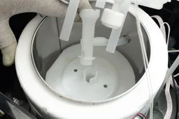 The water baffle and connecting parts seen in a bottom loading water cooler dispenser.