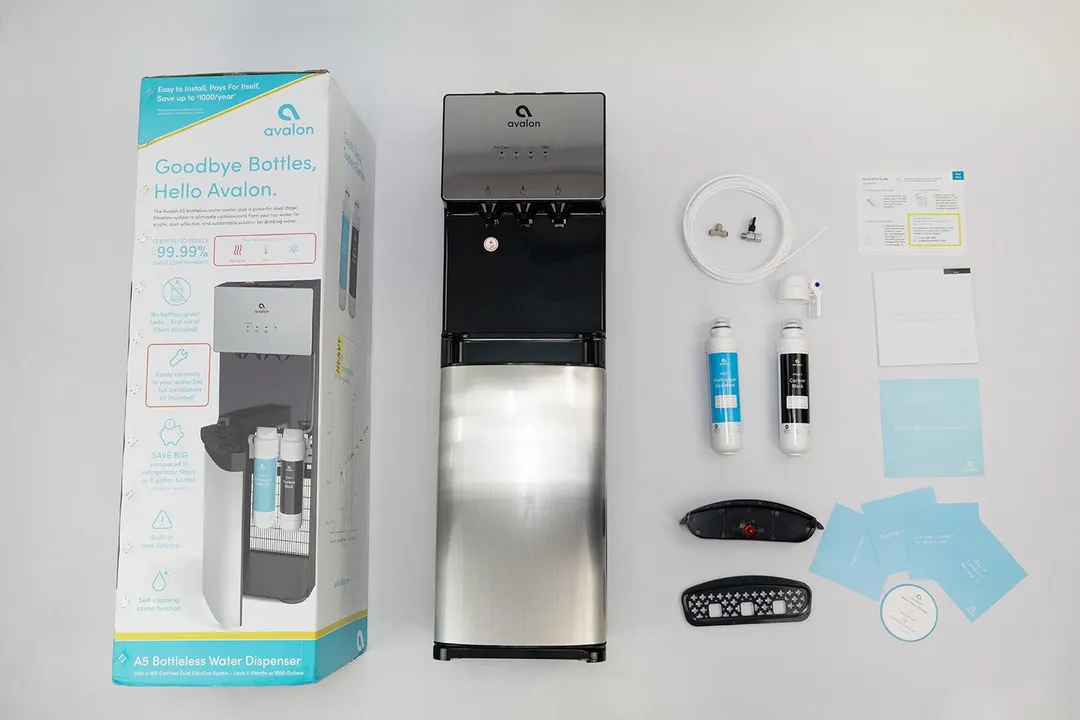 A full view of the Avalon A5 water cooler dispenser, product  box, and bundled items including the manual and leaflets.