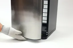 Opening the cabinet of a water cooler dispenser from below and not from the side.