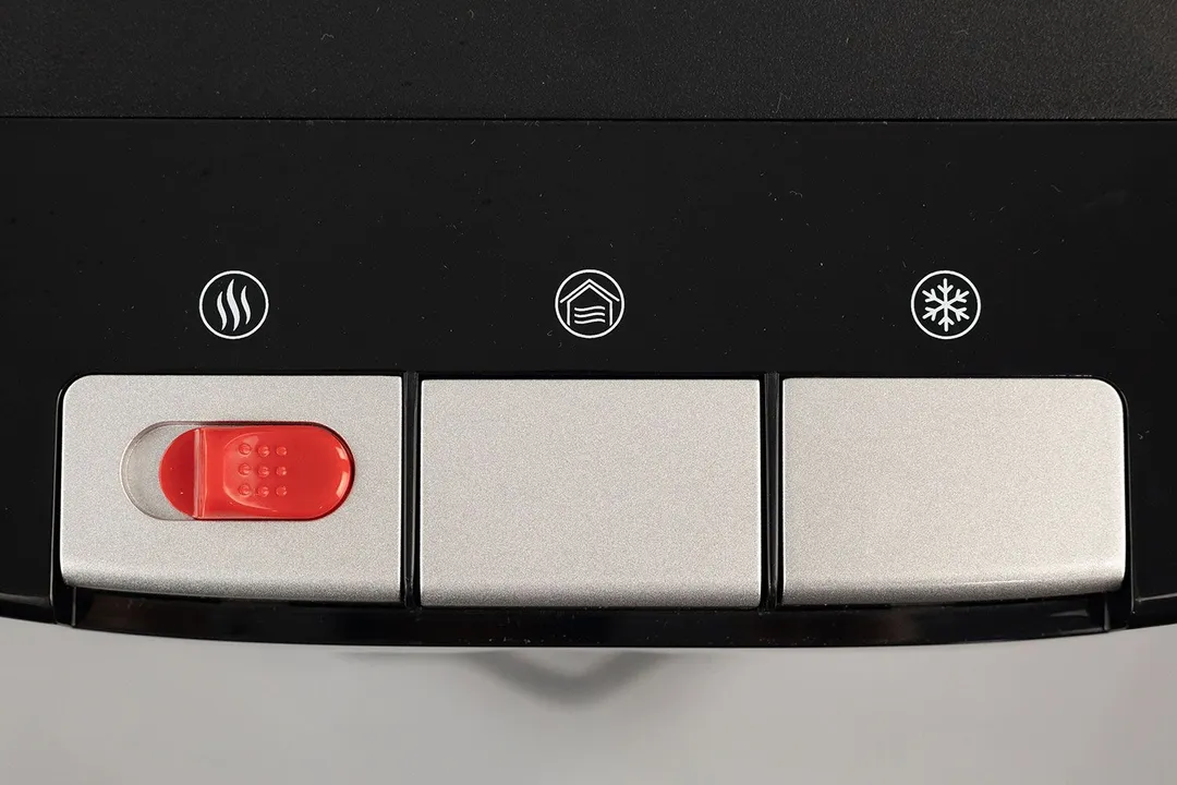 Close up top view of three dispensing buttons on a water cooler dispenser.