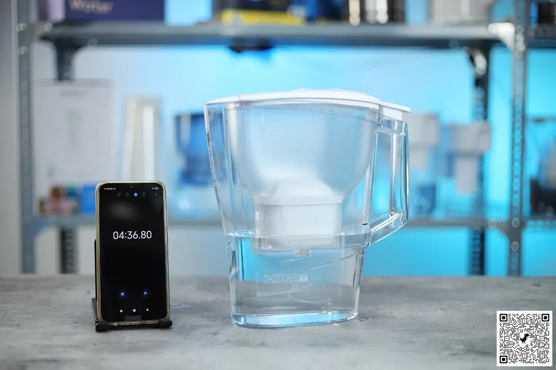 Brita Aluna water filter pitcher next to smartphone timer