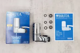 The full content of the Brita Basic’s shipping box, including the filter, six pieces of accessories, and a manual.