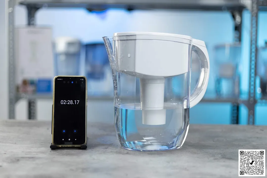 The Brita Everyday with water inside next to a smart phone with timer on screen