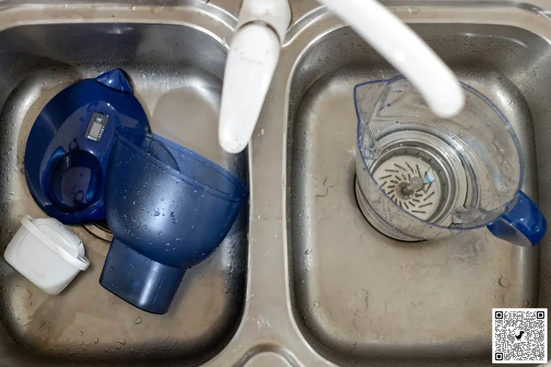 Parts of the Marella XL, wet, in a kitchen sink
