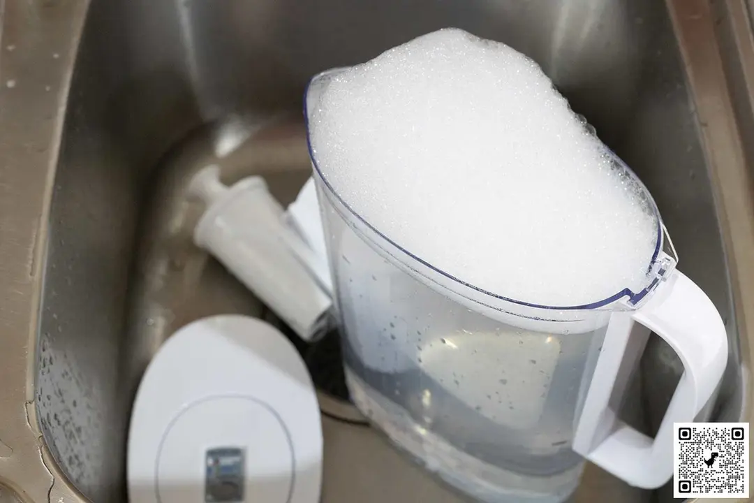 The Brita Metro in a sink, its pitcher filled with soapy water