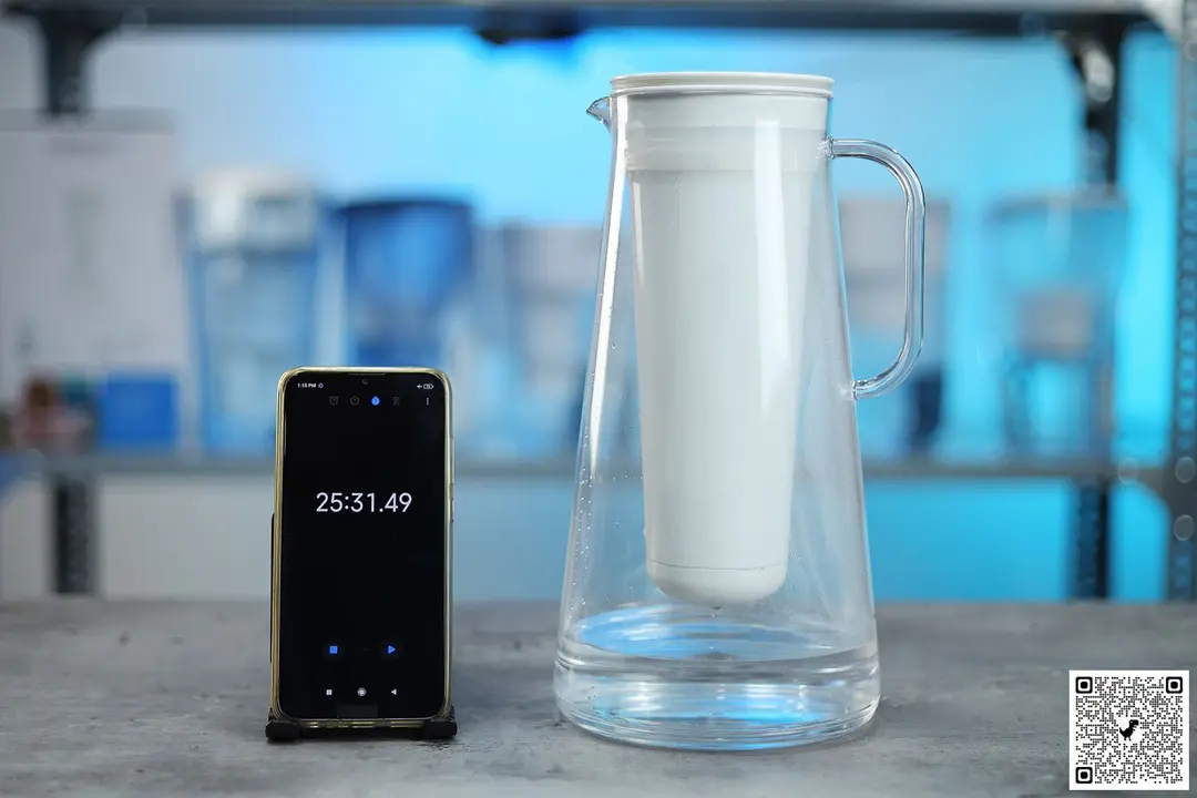 LifeStraw 7 cup water filter jug next to smartphone timer