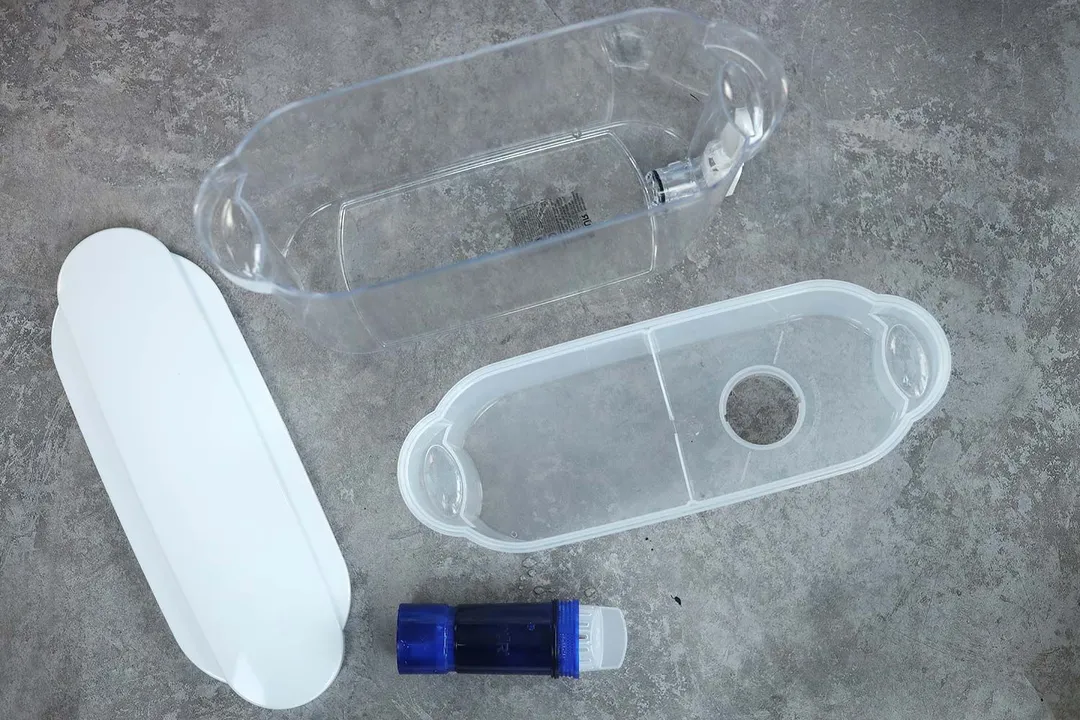 Parts of the PUR plus: the dispenser, reservoir, lid, and filter piece