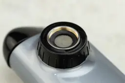 The mounting port of the PUR Plus PFM350V, with the black plastic ring and the metal threading on the inside.
