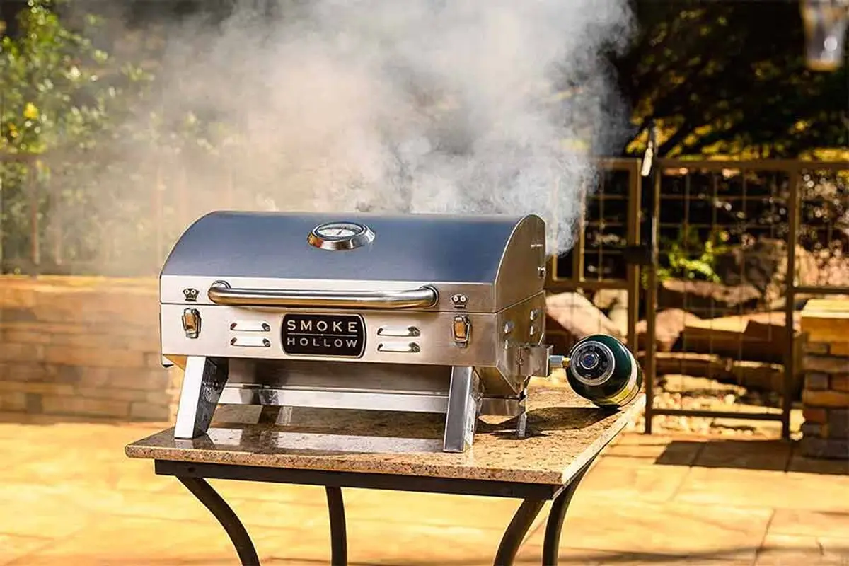 A tabletop propane grill