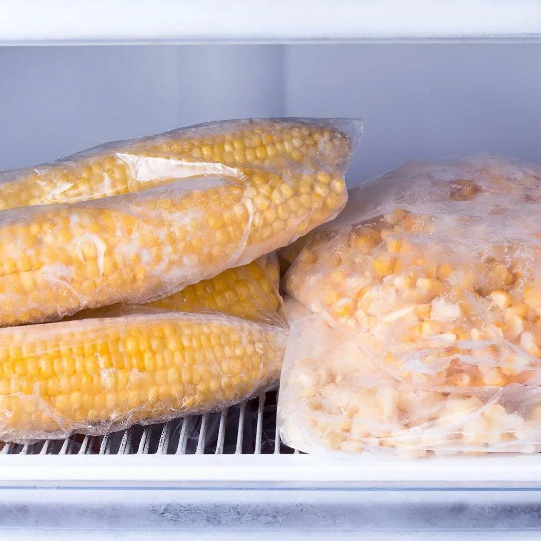 Frozen corn in bag in freezer close up. Frozen food