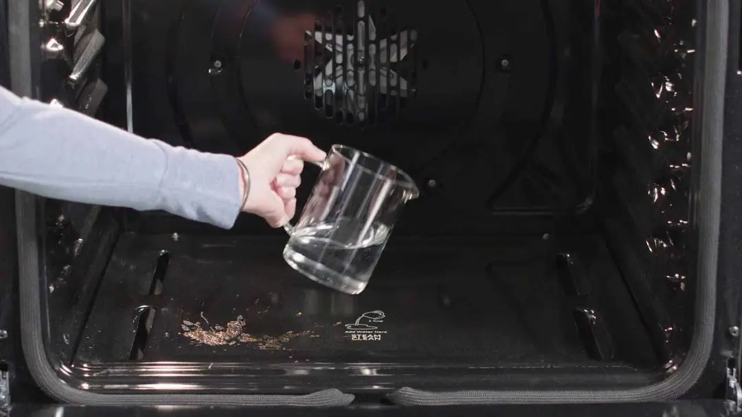Pour a bit of water to the bottom of the oven