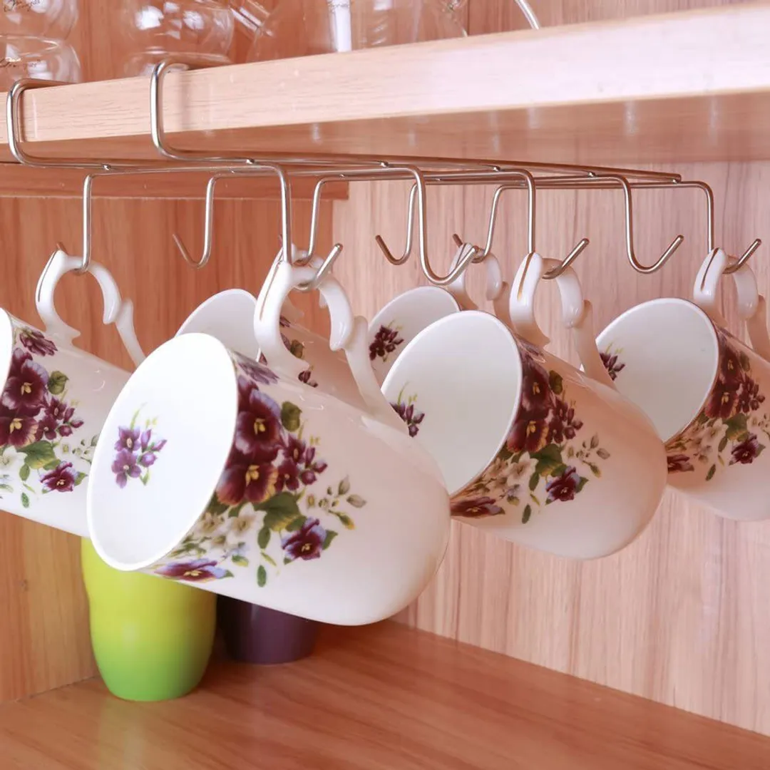 Hooks underneath the cabinet will work as a mug holder