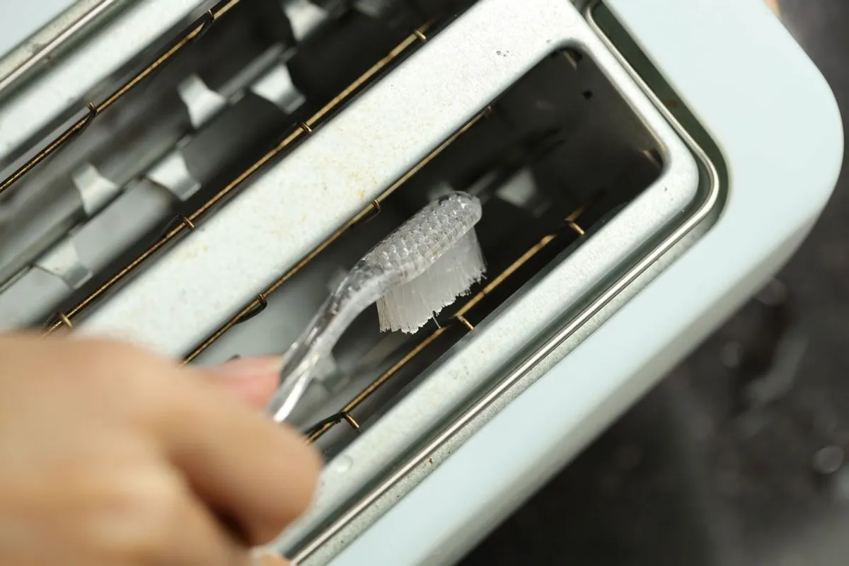 Remove Crumbs to Clean Toaster